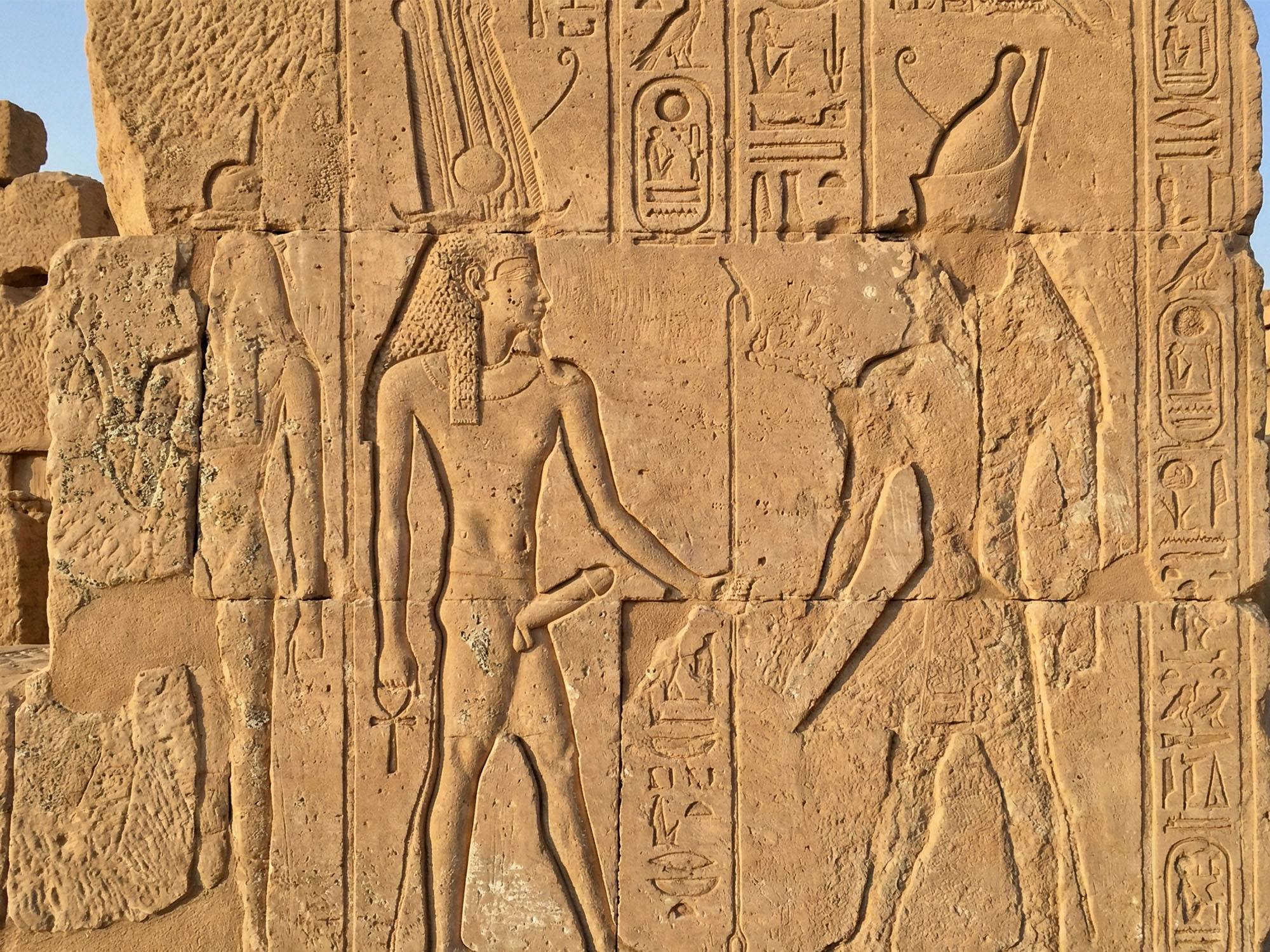 Eroded Egyptian phallic carvings on stone.