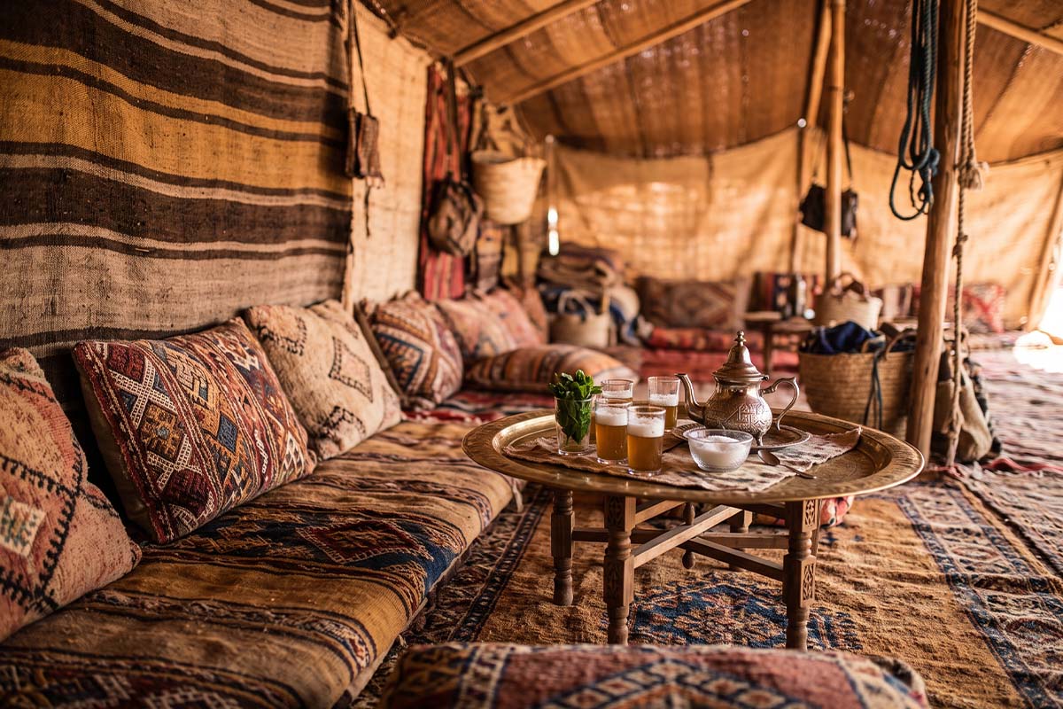 Interior of a traditional tent in the Mauritanian Sahara with woven textiles and cushions