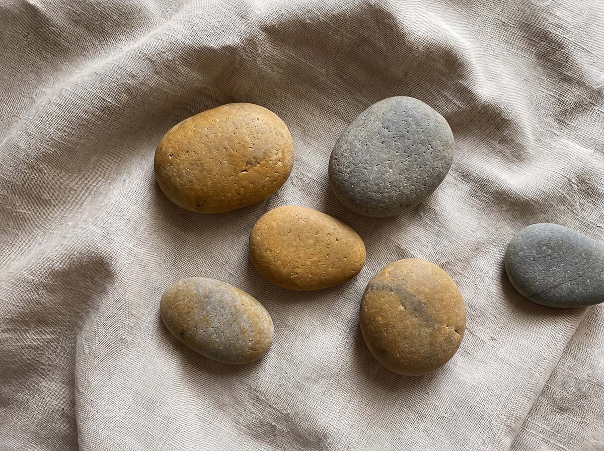 Smooth oval river stones from the Narmada, of the kind used as banalingas in household worship