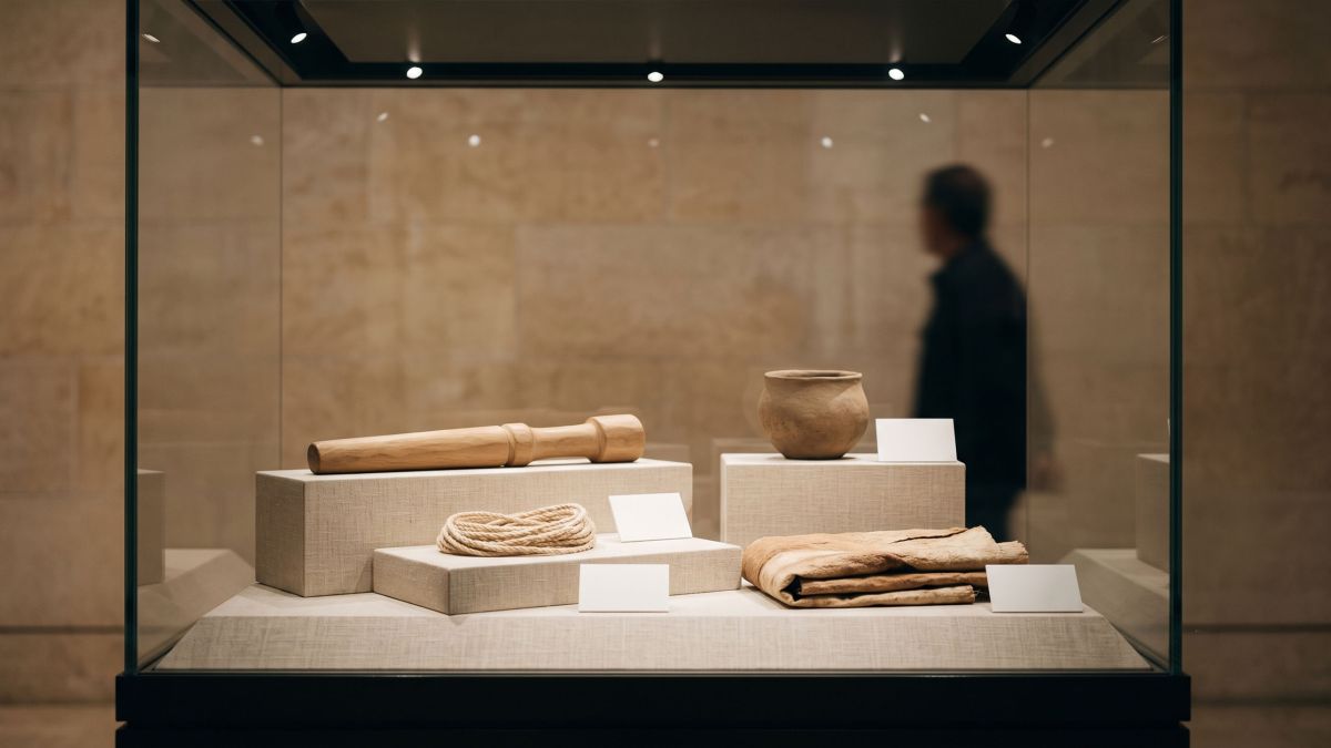 Museum vitrine displaying ceremonial objects, illustrating the anthropology of initiation rites and body symbolism across cultures