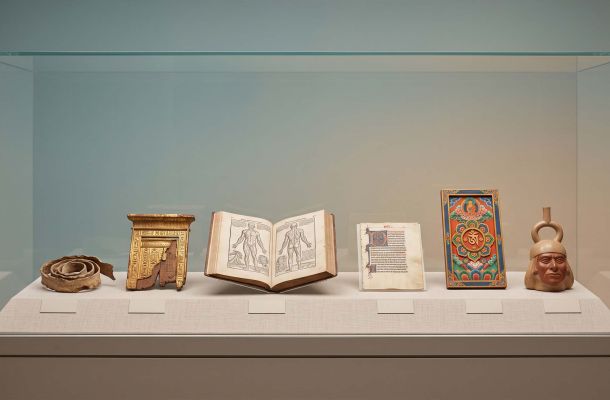 Museum vitrine of artifacts used in a quiz about body rituals and myths from around the world